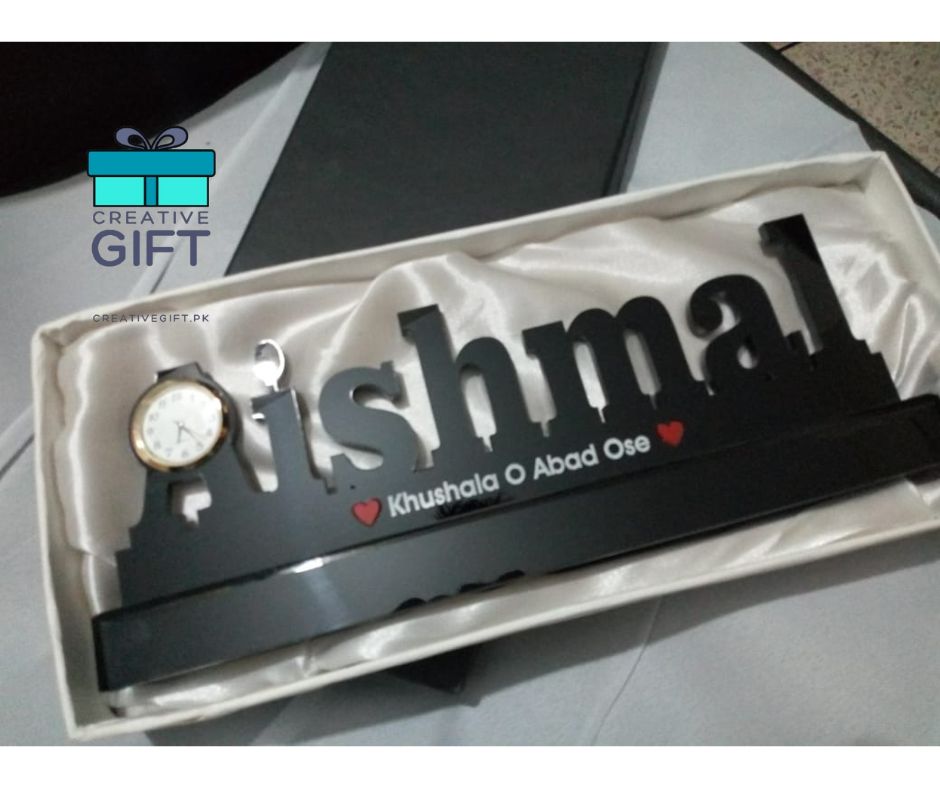 Personalized table name clock with black name design and small round clock on left side