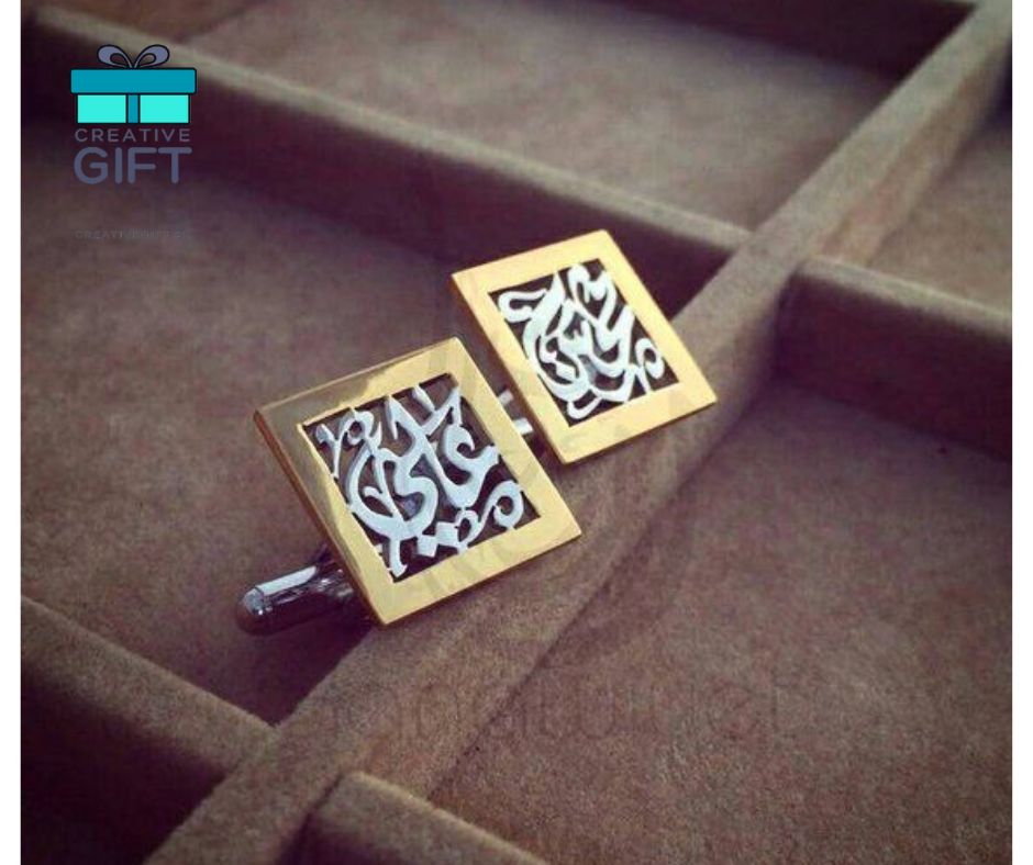 Elegant Arabic calligraphy cufflinks with gold-tone square frame displayed in a brown velvet case
