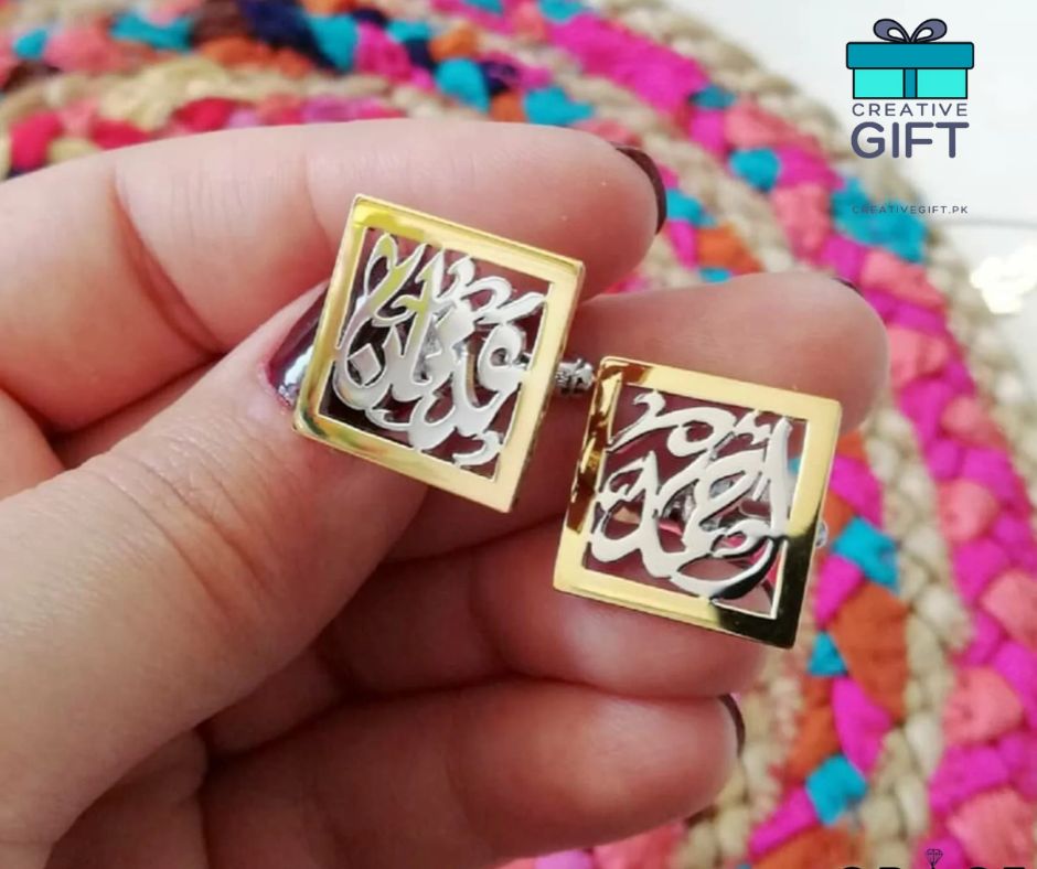 Gold square Arabic calligraphy cufflinks held in hand with colorful woven background