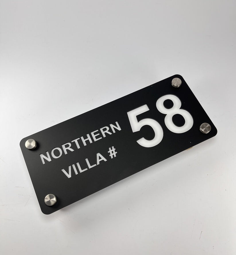 Custom black acrylic house name plate with villa number 58 and metallic mounting screws