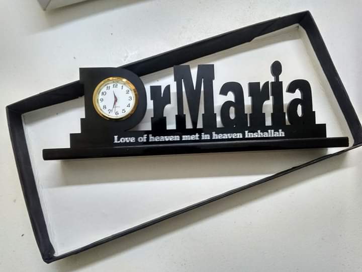 Black wooden doctor name desk clock with white clock face and inspirational quote from Creativegift.pk