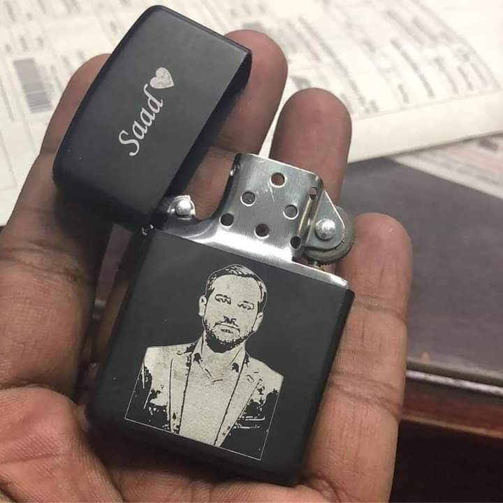 Black engraved lighter gift for men with personalized name Saad and custom portrait design