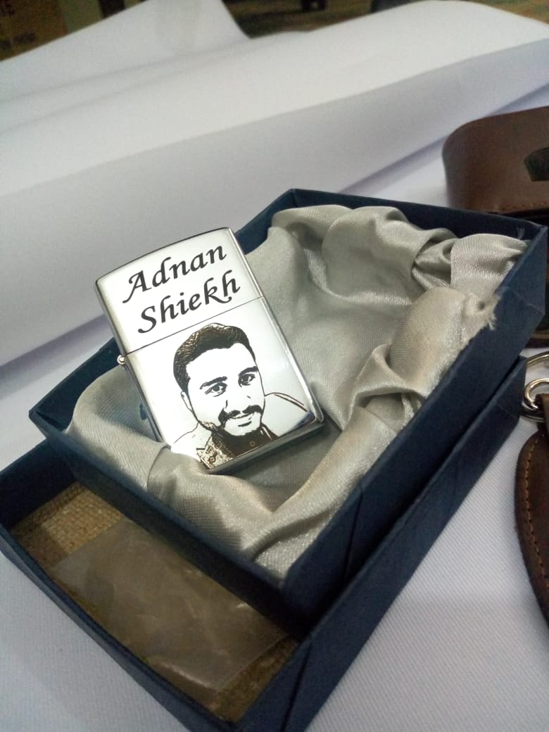 Engraved lighter gift for men personalized with name Adnan Shiekh and a custom face sketch in a gift box
