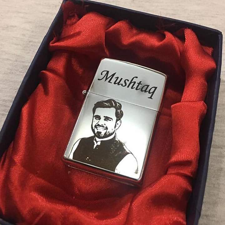 Engraved lighter gift for men personalized with a custom portrait and name in a red satin gift box