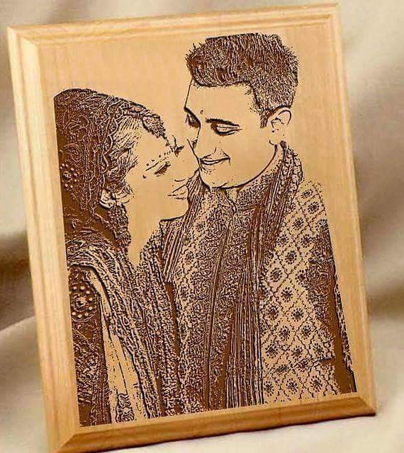 Engraved photo frame for couples featuring a detailed portrait of a smiling couple in traditional attire