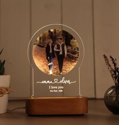 Personalized night light for couples with custom photo and engraved names on wooden base glowing warmly