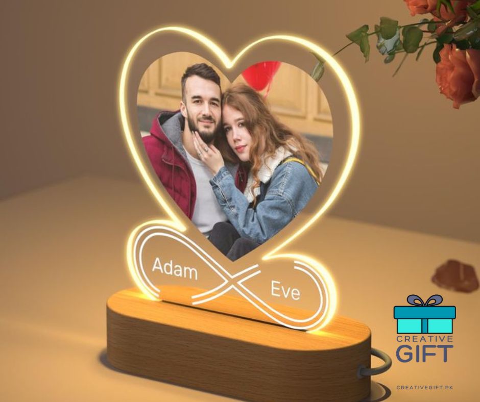 Customized LED photo lamps with heart-shaped design displaying a couple's personalized photo and names