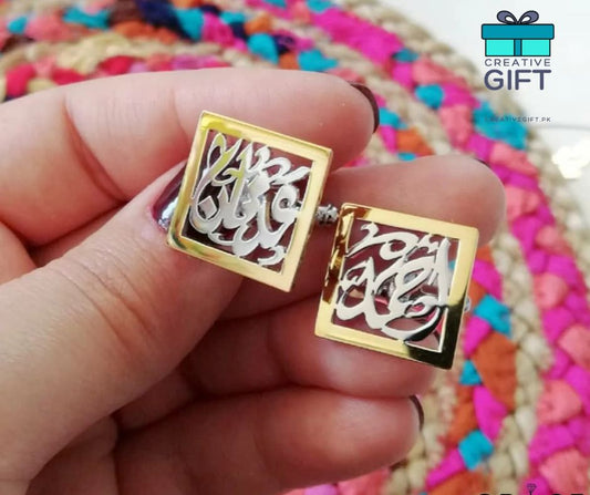 Gold square Arabic calligraphy cufflinks held in hand with colorful woven background