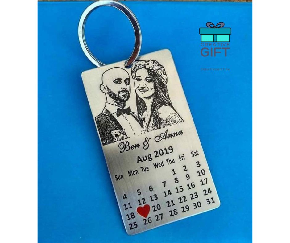 Custom photo metal keychain with engraved couple portrait and calendar showing August 2019 with a heart mark