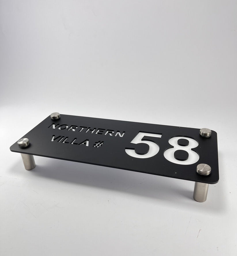 Custom black acrylic house name plate with silver number 58 and Northern Villa text mounted on metal standoffs