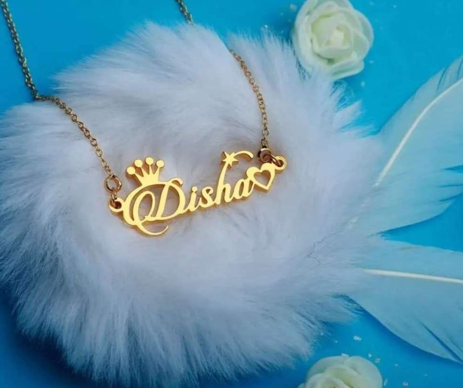 Custom name necklace gold plated with name Disha in cursive font and decorative crown and heart charms
