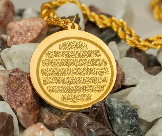 Gold-tone Ayat ul Kursi pendant with intricate Arabic engraving on a twisted chain necklace