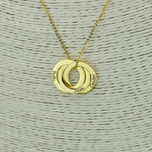 Gold personalized mom necklace with kids names engraved on three interlocking rings