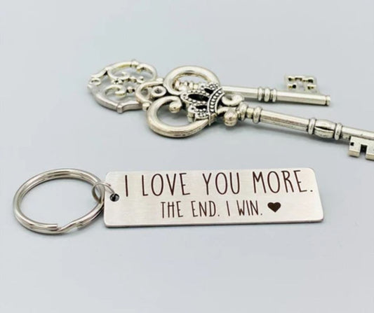 Romantic gift keychain for him with an engraved metal tag saying I love you more the end I win