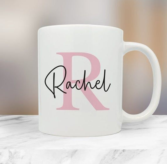 White custom initial name mug with large pink letter R and black script name Rachel